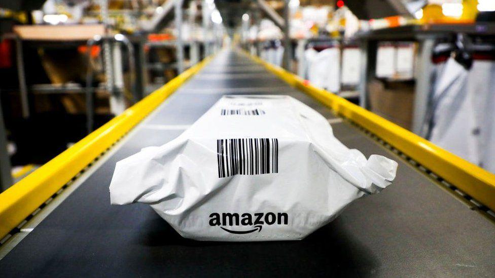 A product sits on a conveyer belt in an Amazon warehouse