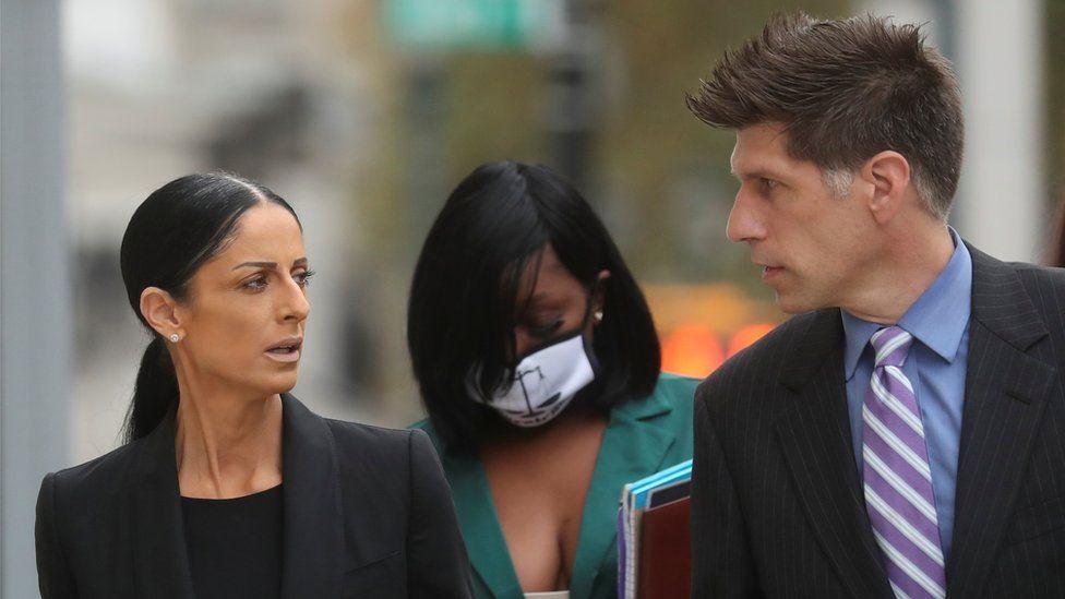 R Kelly's defence attorney Nicole Blank Becker and Thomas Farinella arrive at the court