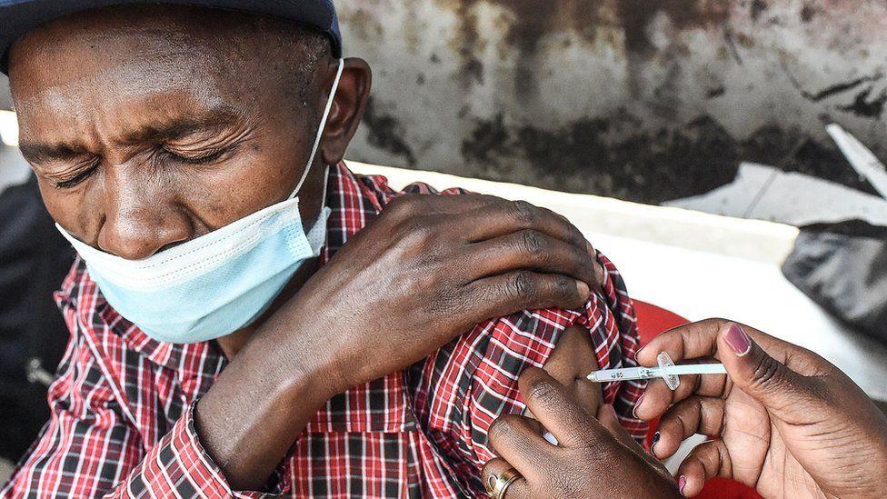 Man getting vaccinated in Kenya
